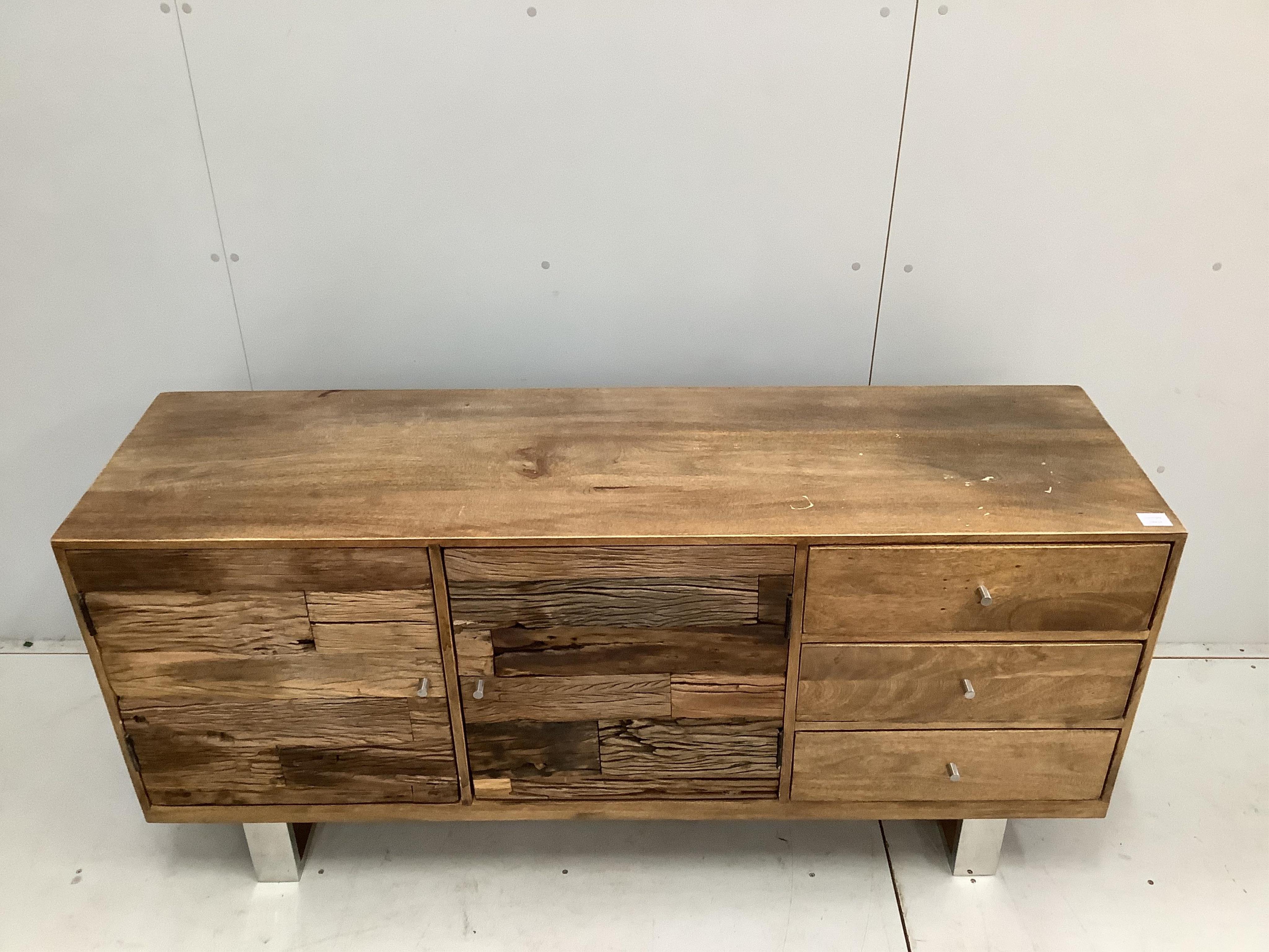 A Contemporary hardwood and weathered wood sideboard on chrome feet, width 161cm, height 76cm. Condition - a little faded with some staining to the top, otherwise good